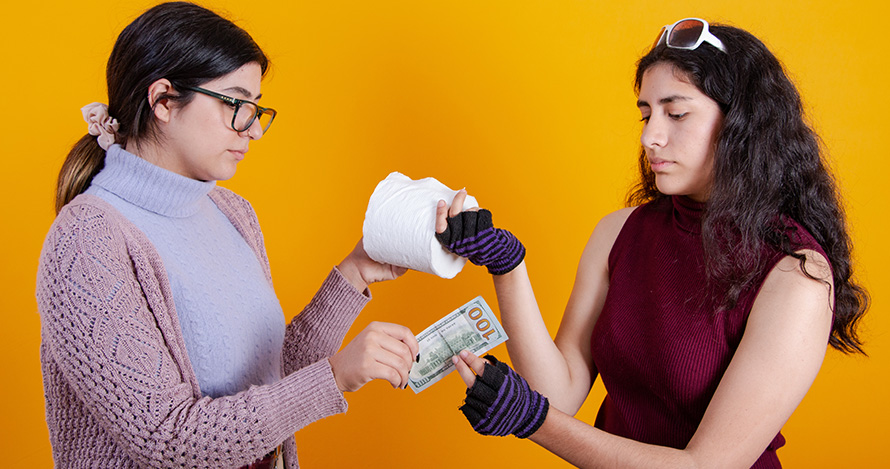 A price-gouger sells toilet paper to a woman for an exorbitant price.