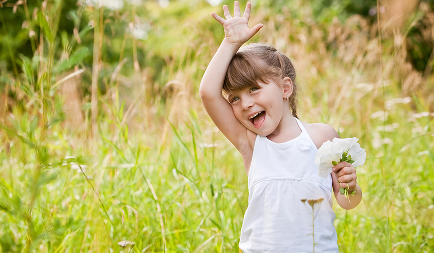 Smiling girl waving goodbye