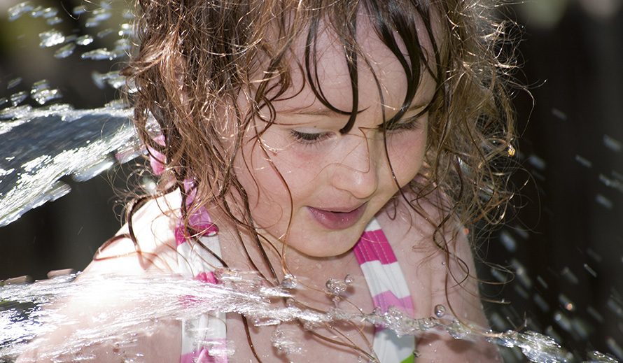 Happy little girl at a water park.